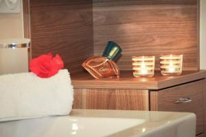 a bathroom with candles and a counter with a sink at Alpenchalet Niederkofler Marilena in San Giovanni in Val Aurina +12 photos