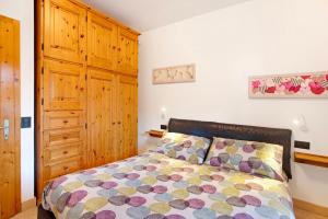 Ένα ή περισσότερα κρεβάτια σε δωμάτιο στο Appartamento Arlecchino Livigno