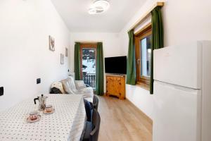 Μια τηλεόραση ή/και κέντρο ψυχαγωγίας στο Appartamento Arlecchino Livigno