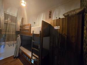a room with two bunk beds and a ladder at Narjiss Hostel in Fès +19 photos