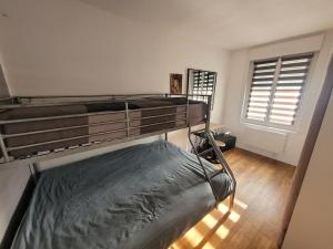 Ένα ή περισσότερα κρεβάτια σε δωμάτιο στο Le Compostelle