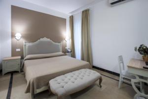 Postel nebo postele na pokoji v ubytování Hotel Gargallo