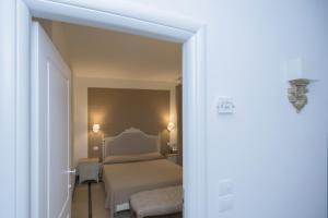 Postel nebo postele na pokoji v ubytování Hotel Gargallo