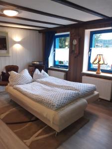 Ένα ή περισσότερα κρεβάτια σε δωμάτιο στο Ferien im Kräuterstübchen