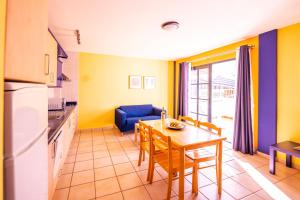 a kitchen and dining room with a table and chairs at Nautilus 2 in Puerto Naos +14 photos