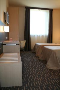 Un pat sau paturi într-o cameră la Hotel Verdina