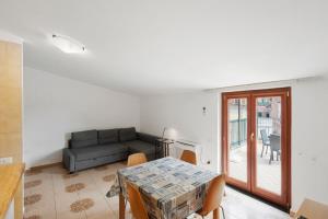 a living room with a couch and a table at Ce Tour - Casa Cetara Centro 1 in Cetara