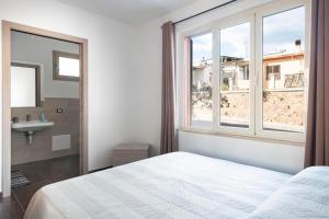 Ένα ή περισσότερα κρεβάτια σε δωμάτιο στο Damaria