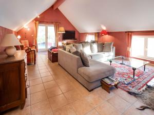 a living room with a couch and a table at Luxury Pool Villa in Sosoye in Sosoye