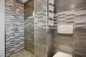 a bathroom with a shower and a toilet at Casa Helieta in Puerto del Rosario +18 photos