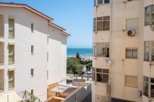 a view of the ocean from the balcony of a building at Rocha Beach Apartment in Praia da Rocha