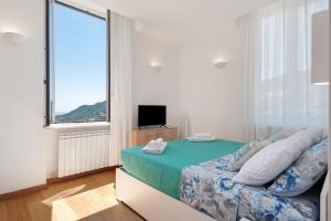 Ένα ή περισσότερα κρεβάτια σε δωμάτιο στο Casa Dica Santa Margherita Ligure