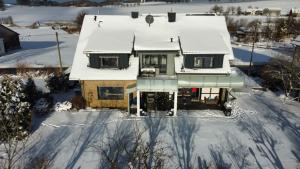 an aerial view of a house covered in snow at Wiesenblick in Brilon