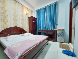 Krevet ili kreveti u jedinici u okviru objekta KHÁCH SẠN THU NGUYỄN - Ngay BẾN NINH KIỀU, CHỢ ĐÊM +37 fotografija