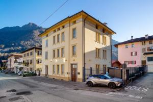 a small car parked in front of a building at Appartamento Zeller Tione in Tione di Trento