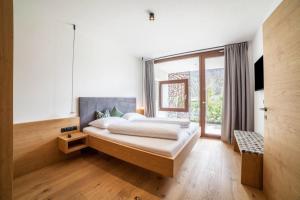 Ένα ή περισσότερα κρεβάτια σε δωμάτιο στο Camping Passeier Apartment Abendrot +21 φωτογραφίες