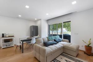 a living room with a couch and a table at Vale viver in Vale de Cambra