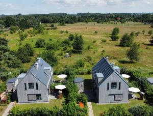 an aerial view of two houses in a field at SandKorn 1 und 2 in Pruchten