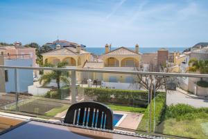 a balcony with a view of the ocean at Apt Brightness Comfort In Burgau in Burgau