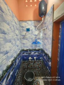 a bathroom with a painting of a bath tub at Le homestay villa in Puducherry +15 photos