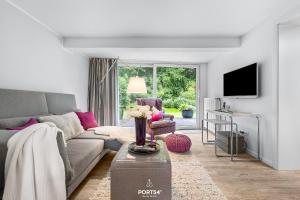 TV a/nebo společenská místnost v ubytování Ferienhaus Ostsee Hideaway Maasholm Bad
