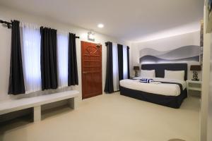 Ένα ή περισσότερα κρεβάτια σε δωμάτιο στο El Fuego Boracay