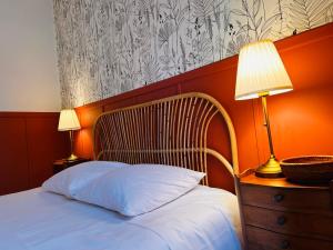 Ένα ή περισσότερα κρεβάτια σε δωμάτιο στο Ciel Etoilé Cocon Chic en hyper-centre