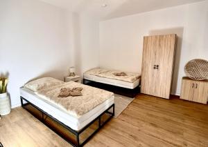 Postel nebo postele na pokoji v ubytování FlexHome Stadtnatur Ferienwohnung