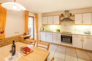 Kuchyň nebo kuchyňský kout v ubytování Voppichlhof App Edelweiss + 9 fotografií