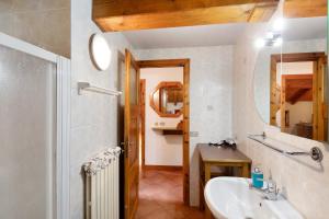 a bathroom with a sink and a mirror at Baita Campacc Marco in Livigno +16 photos