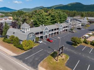 an aerial view of a hotel with a parking lot at The Green Granite North Conway, an Ascend Collection Hotel in North Conway