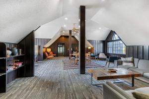 a living room with a couch and a table at The Green Granite North Conway, an Ascend Collection Hotel in North Conway