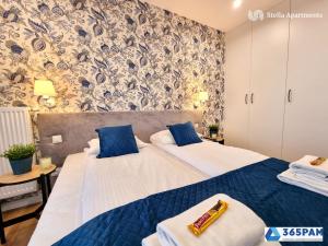 Кровать или кровати в номере 365PAM - Westin House LUX - GARAŻ, BASEN, JACUZZI, SAUNA, SIŁOWNIA, PLAC ZABAW W CENIE