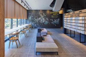 a row of tables and chairs in a restaurant at hotel around TAKAYAMA, an Ascend Collection Hotel in Takayama