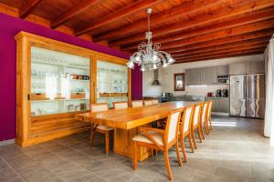 a dining room with a wooden table and chairs at Finca Conies Romaní in Manacor