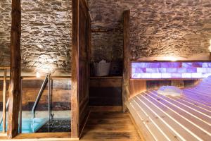 a room with two bunk beds and a stone wall at Civico 12 in Marmora