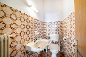 a bathroom with a sink and a toilet at Eggerhof Familienparadies in Verano +11 photos