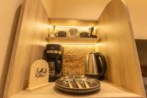 Køkken eller tekøkken på استوديو فاخر بتصميم عصري + 20 billeder