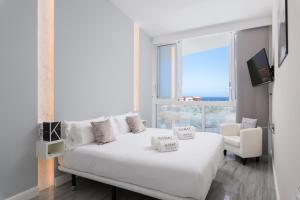 En eller flere senge i et værelse på Karat Villa Ocean Golf + 30 billeder