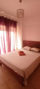 En eller flere senge i et værelse på T2 Edificio Aquazul