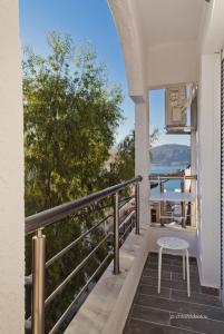 a balcony with a table and a view of the ocean at Helios Apartment 2 in Karpathos Town