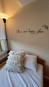 a bedroom with a bed with a this is our happy place at Superior App 229 mit Pool und Sauna in Braunlage +29 photos