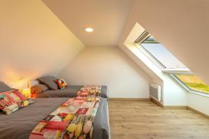 Postel nebo postele na pokoji v ubytování La Maison Des Gardiens De L'océan -