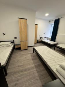 a room with three beds in it at Хостел "Батискаф" in Bila Tserkva