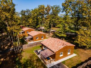 an overhead view of a large house with trees at Gite 3 de l'Orée du Bois in Thenon