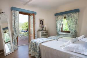 Postel nebo postele na pokoji v ubytování Agriresort & Spa Fattoria I Ricci