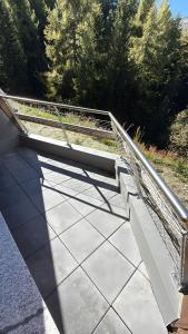 a metal railing on the side of a walkway at Secret Place - Pila Appartamenti in Pila