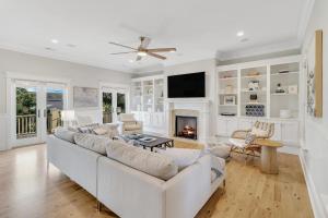 a living room with a couch and a fireplace at CM3008: 3008 Cameron Blvd. in Isle of Palms