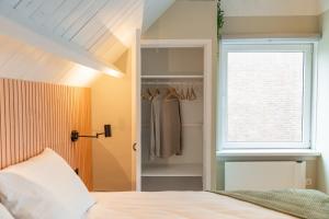 Ένα ή περισσότερα κρεβάτια σε δωμάτιο στο Wijngaardstraat 5A