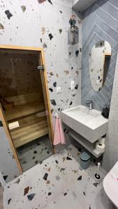 a bathroom with a sink and a broken wall at lovNatura in Staniszów